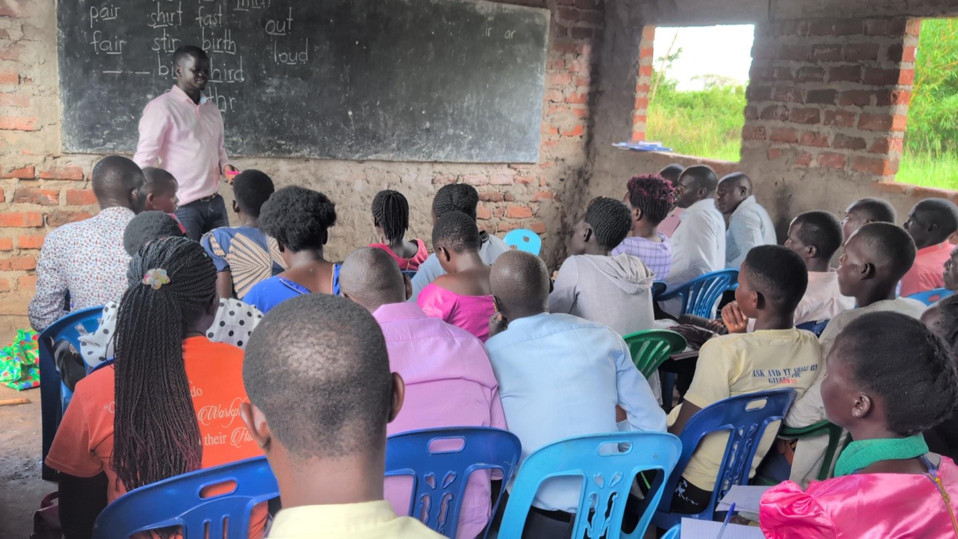 Coaches and stakeholders reviewing literacy data via mobile tools